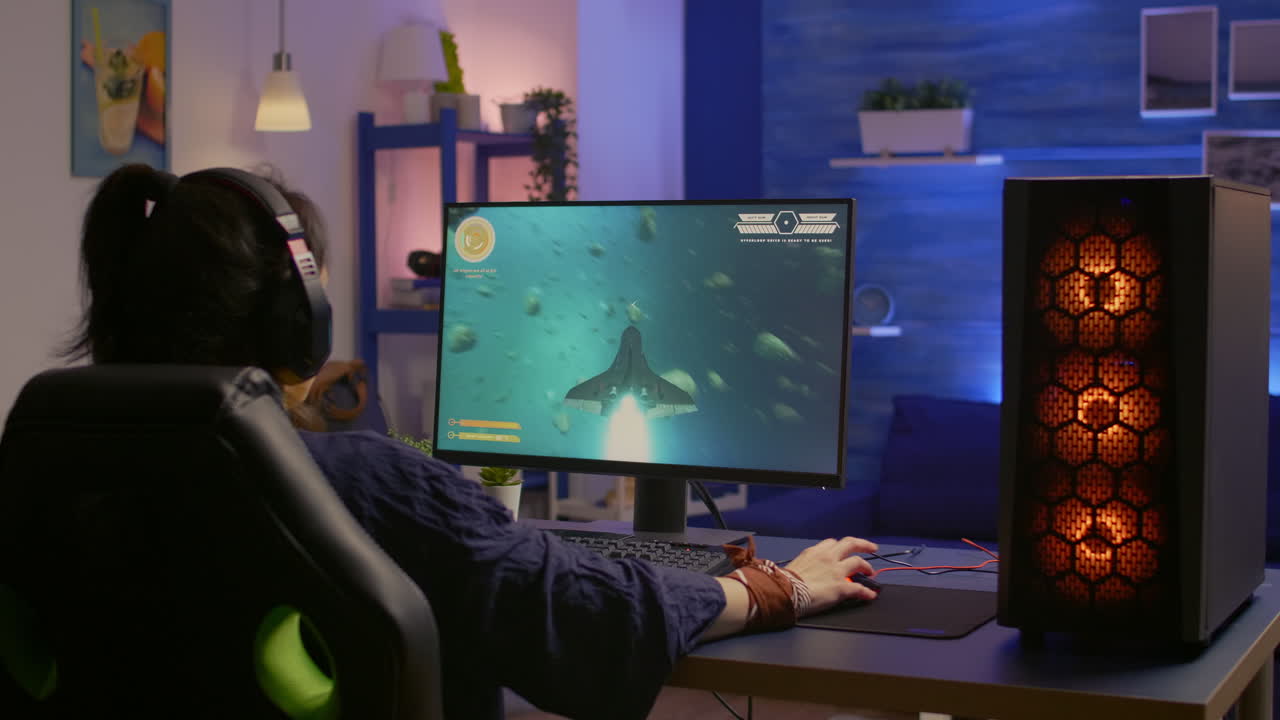 Back shot of focused cyber player wearing headset