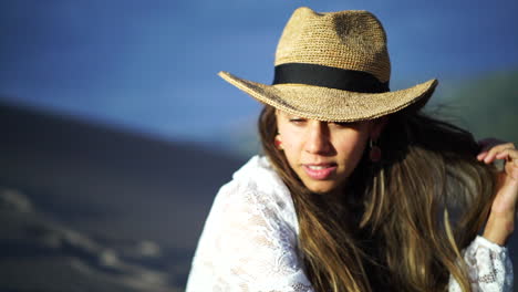 hats on smiling cinematic female women actress model cowgirl outfit wind walking top ridge colorado the great sand dunes national park scenic mountain landscape gold light adventure rocky mountains