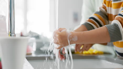 kid, washing and hands with mom with foam