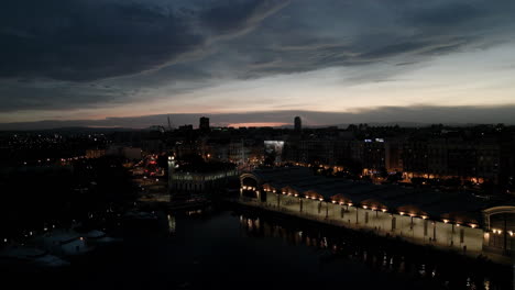 drone flying over city during sunset in valencia, spain