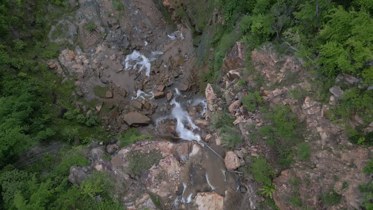 Following the river until it plunges off the cliff and becomes a waterfall