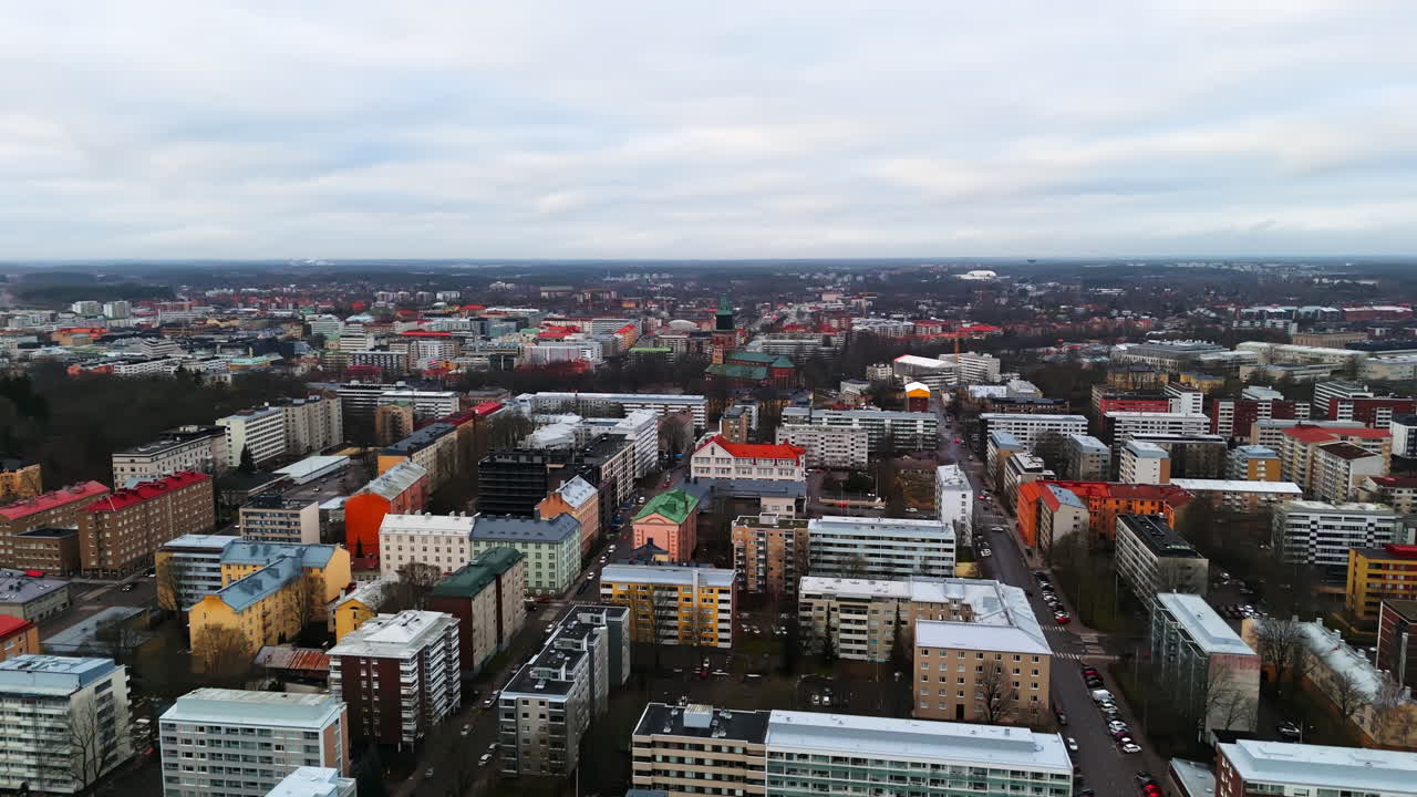 Aerial view flying over the cityscape of Turku city, wet, gloomy day in Finland