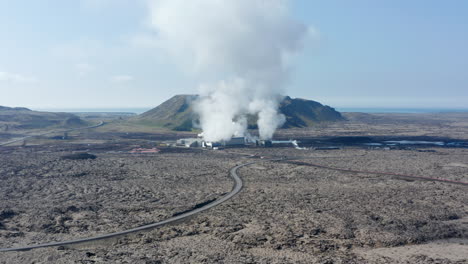 Aerial-view-flying-over-a-geothermal-power-plant-in-Iceland.-Drone-View-over-power-station-producing-alternative-green-energy-steaming-hot-water