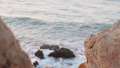 waves-breaking-over-rocks-in-Hadera-beach,-Israel