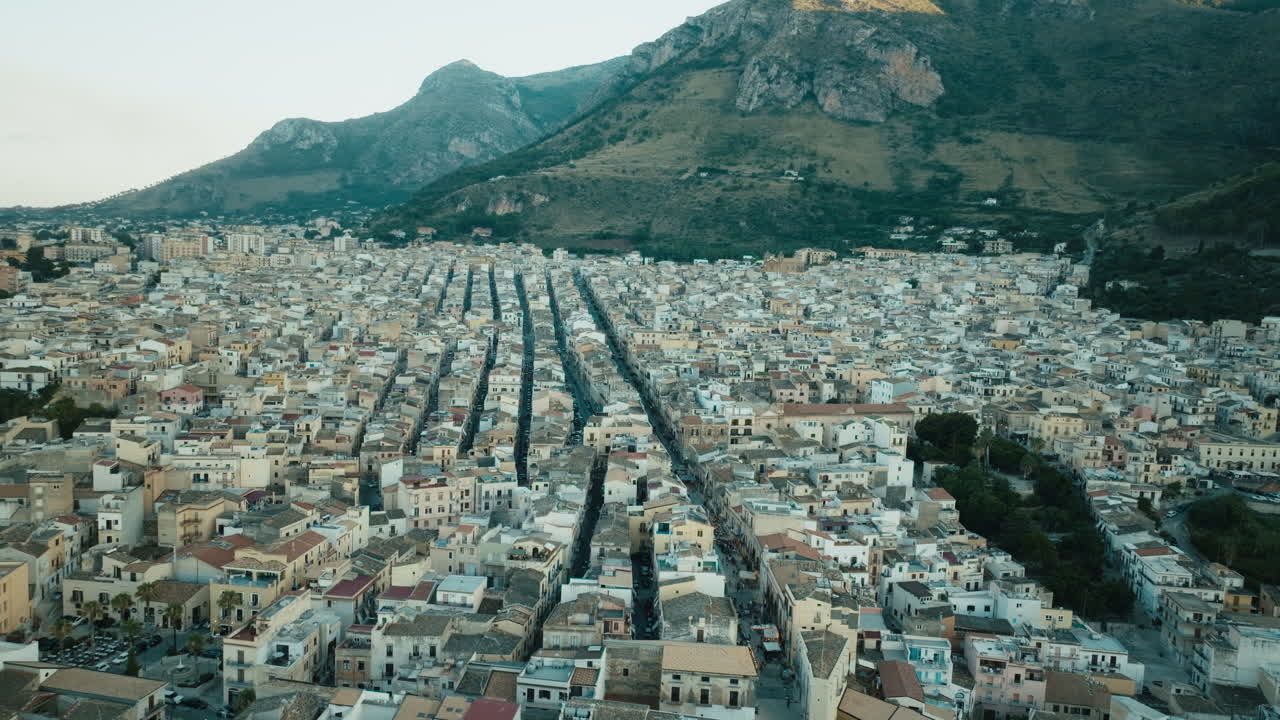 Cinematic aerial over Castellammare del Golfo town Sicily Italy after sunset Part 2