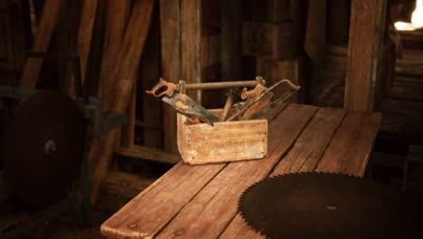 old wooden toolbox with various hand tools on a rustic workbench in a workshop