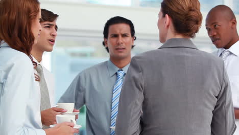 business people having a conversation at break time