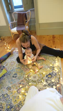 family stretching session with christmas lights