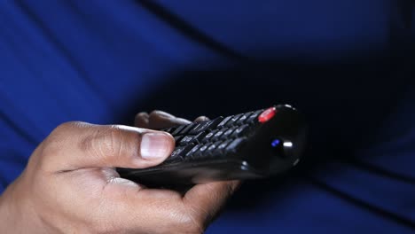 hand holding a tv remote control