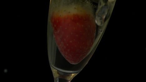 Strawberry-falling-into-flute-of-champagne