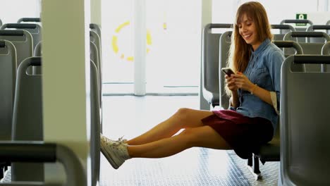 Woman-using-mobile-phone-while-travelling-in-ferry-4k