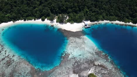 view on white sandy beautiful lagoons and reefs in raja ampat, wayag, indonesia