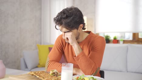 disabled young man crying at home.