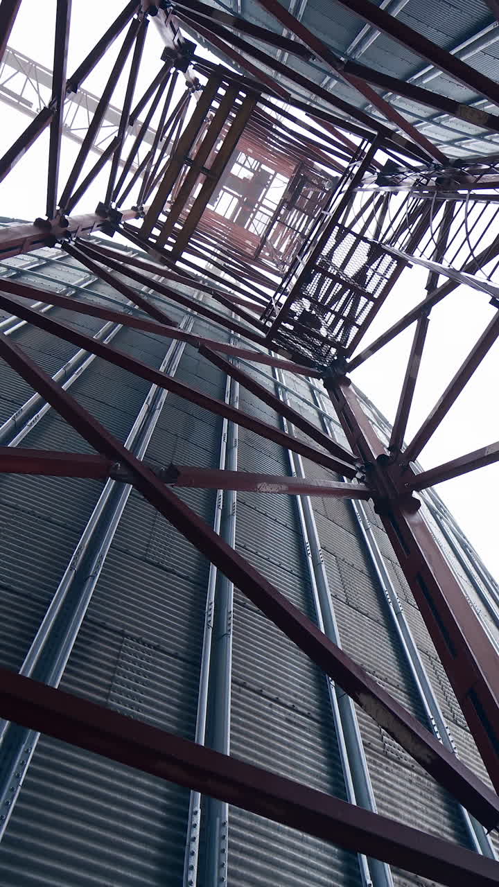 Big factory elevator construction. Storage granary technology tank