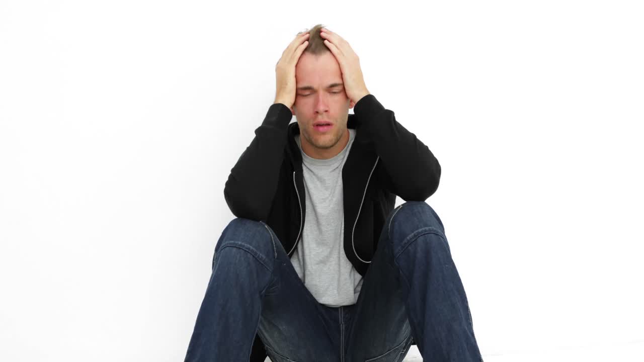 Upset young man thinking about his life