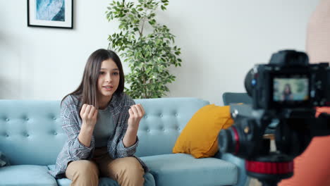 teenager being interviewed at home.