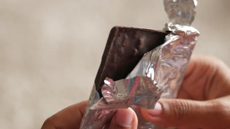 unwrapping a chocolate bar