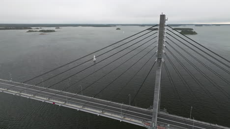 cruising sailboat close to replot bridge in finland during autumn season