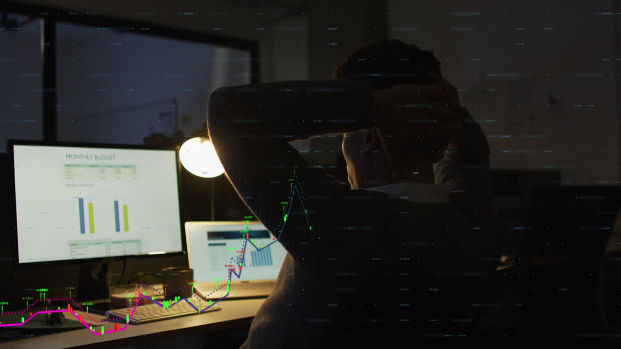 Animation of financial data processing over biracial businessman working in office