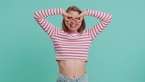funny comical woman making silly facial expressions and grimacing fooling around showing tongue