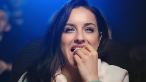 cheerful woman watching comedy indoor