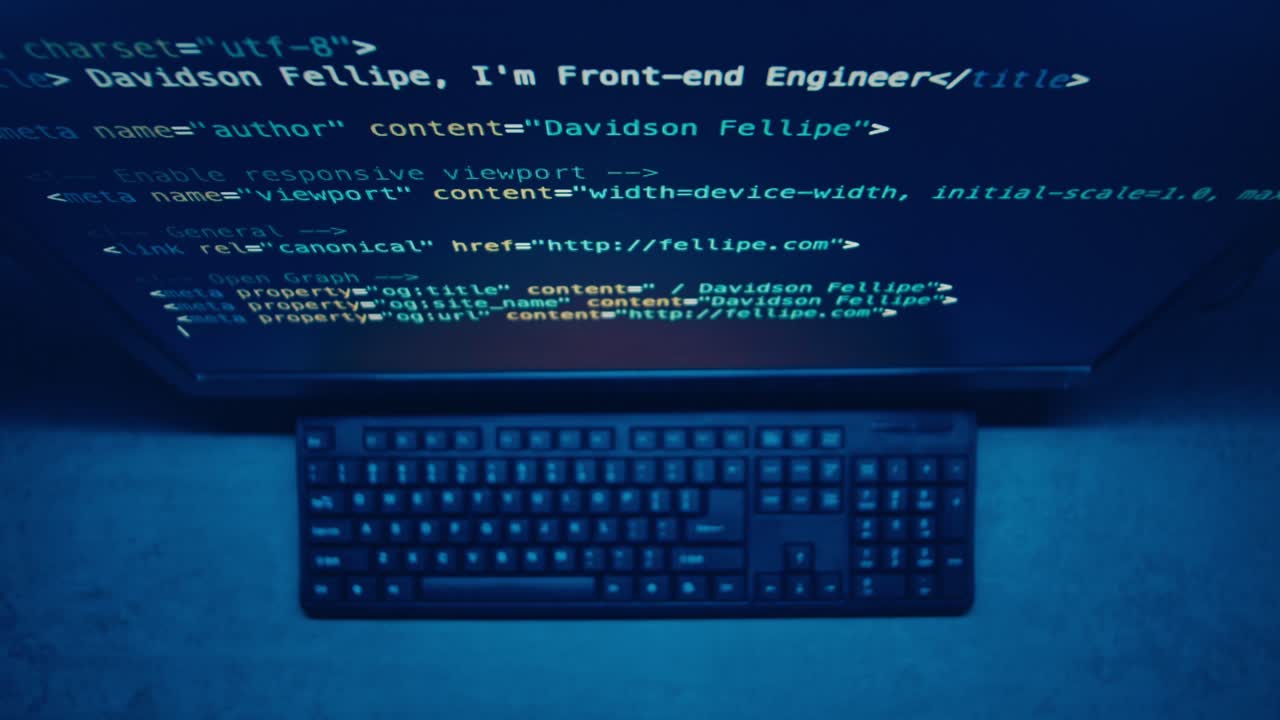 Computer Screen Showing Code and Keyboard