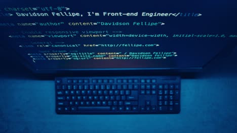 computer screen showing code and keyboard
