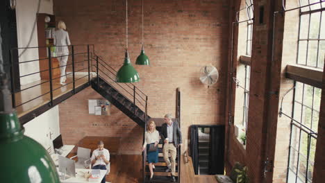 Crane-shot-in-busy-office-open-plan-boardroom-area