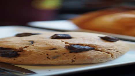 close-up of a chocolate chip cookie on a plate