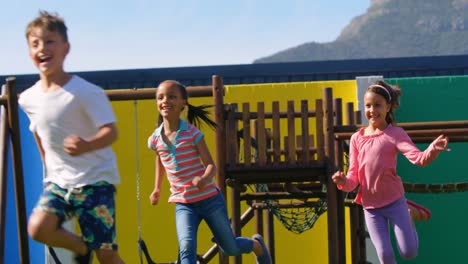 front view of mixed-race schoolkids playing in the school playground 4k