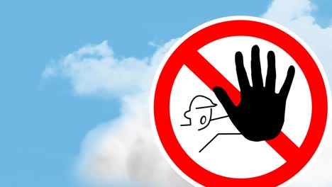 signboard post with stop gesture against clouds in the blue sky