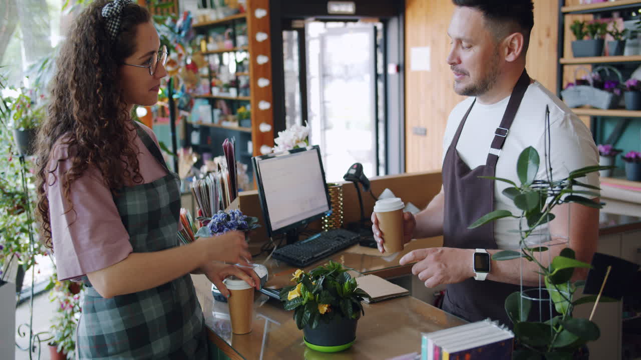 Customer paying at a florist shop