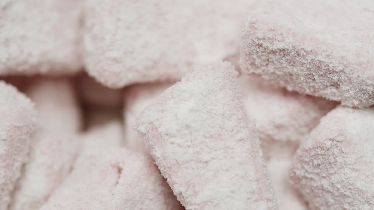 Pink Marshmallows Covered in Powdered Sugar