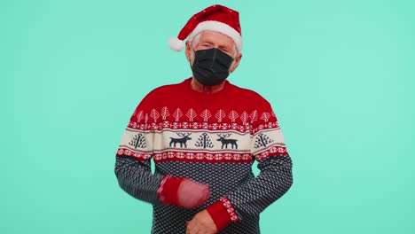 senior christmas grandfather wearing face mask ppe to safe from coronavirus on lockdown quarantine