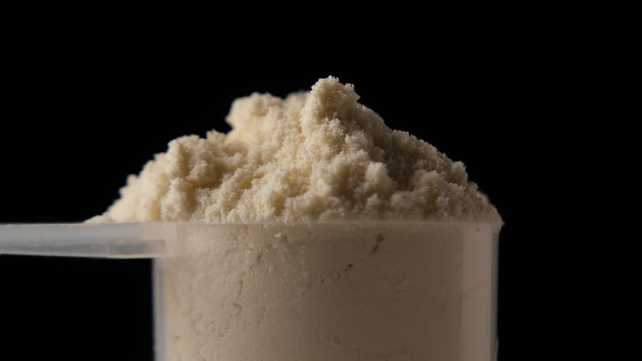 Protein powder in scoop, close up
