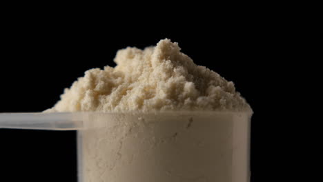 protein powder in scoop, close up
