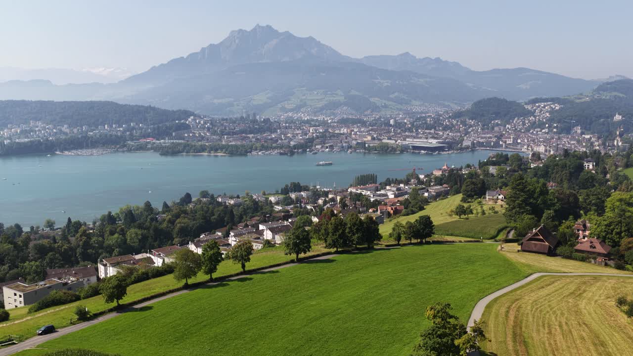 revealing view of Lucern, Switzerland, Alps in the background. City skyline views