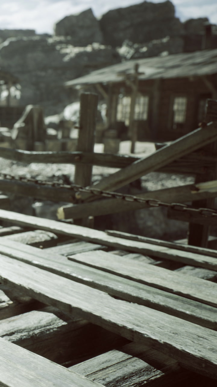 Wooden structures capture the essence of an abandoned landscape in sunlight