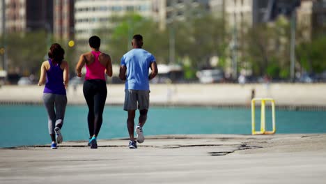 athletic multi ethnic people running outdoors in city