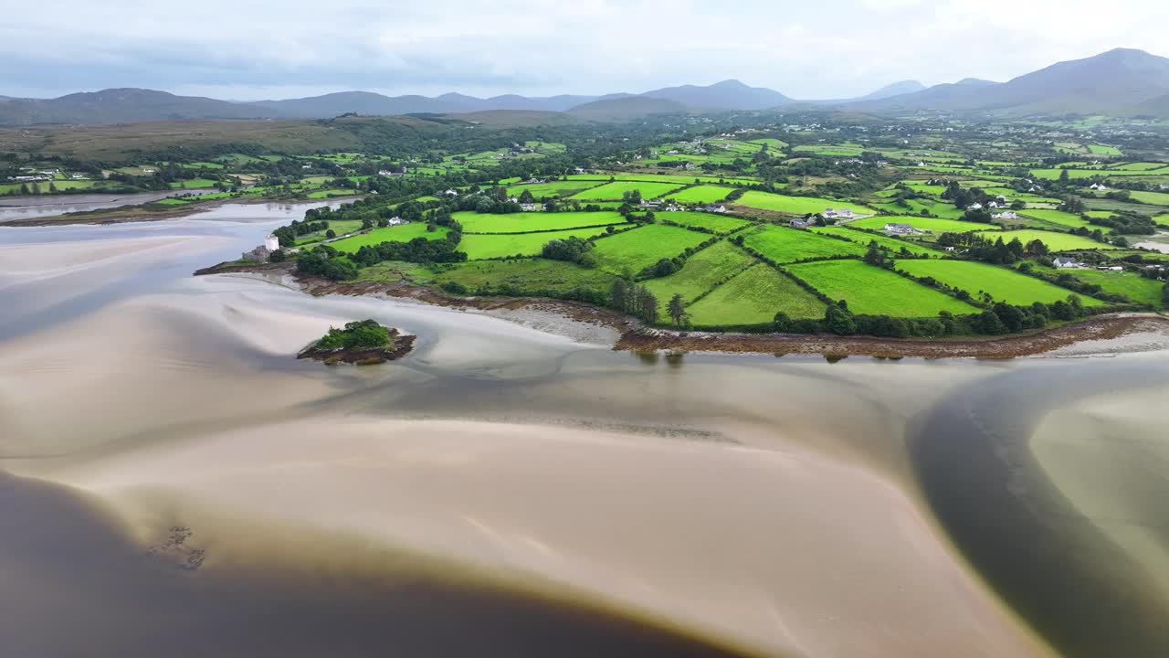 Amazing coastal landscape of Donegal, green pastures and mountain background, Doe Castle