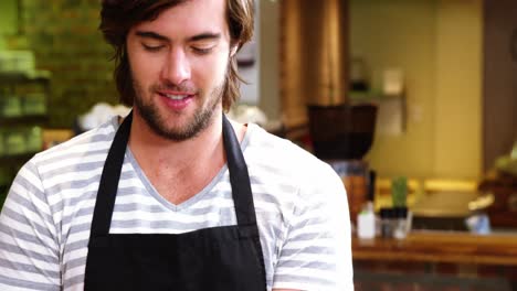 male waiter using digital tablet