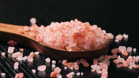 himalayan pink salt in a wooden is used to flavor food. due mainly to marketing costs, pink himalayan salt is up to twenty times more expensive than table or sea salt.