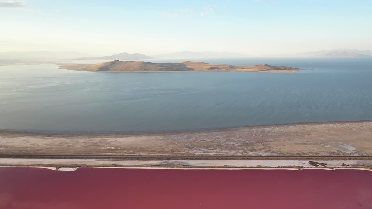 Aerial View of Great Salt Lake and Pink Lagoon, Utah USA. Colorful Waters Scenery Under Summer Sun, Drone Shot