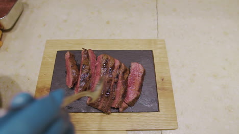 Preparing-meat-fillet-at-restaurant-before-serving,-Milan---Italy