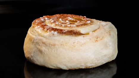 timelapse - homemade cinnamon bun baking and rising in electric oven: close up