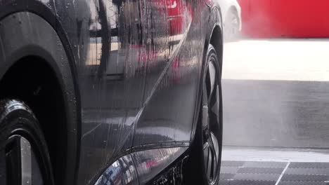car washing at a self-service wash bay