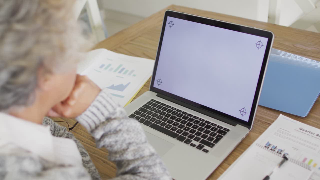 African american senior woman having a video call on laptop with copy space at home
