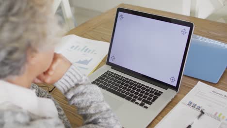 African-american-senior-woman-having-a-video-call-on-laptop-with-copy-space-at-home