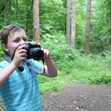 boy in wilderness area taking picture