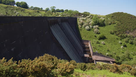 meldon reservoir dam with sluice gates closed on sunny summer day, dartmoor national park